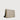 Angled front view of a beige crossbody bag with adjustable black strap on a white background